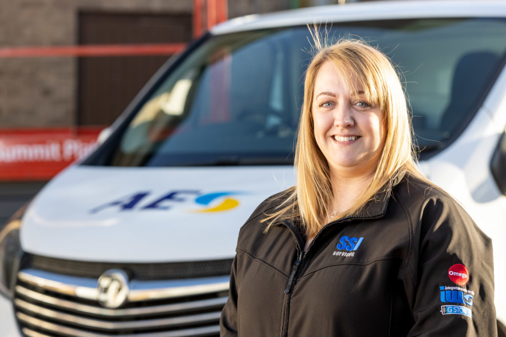 Female Employee in Front of Van